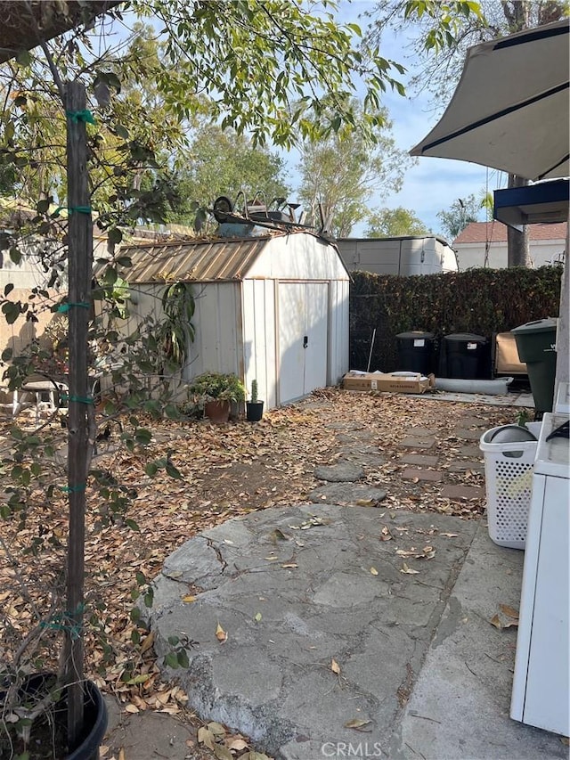 exterior space with a storage shed