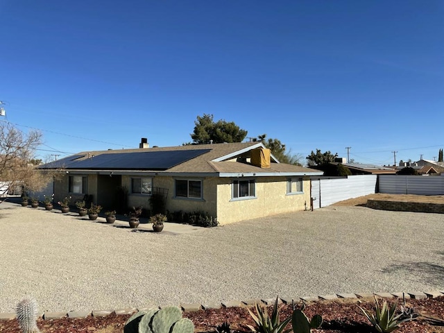 exterior space featuring solar panels