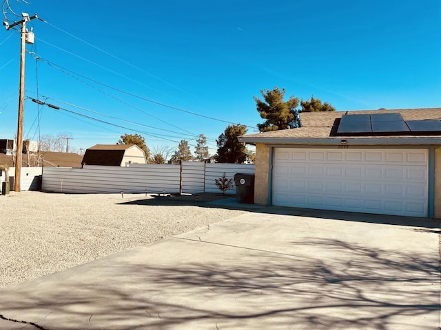 garage featuring solar panels