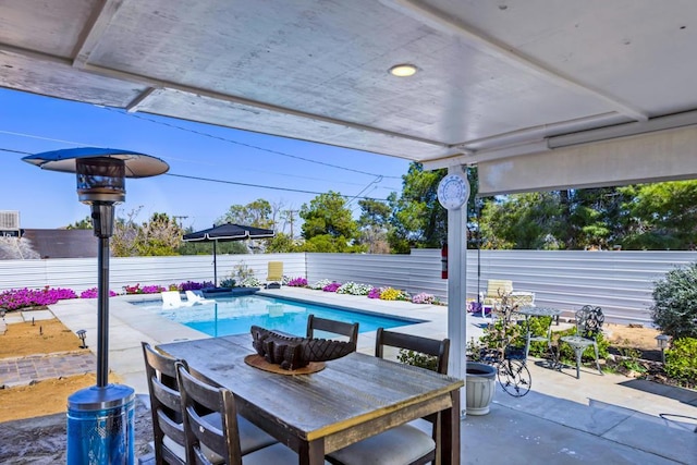 view of patio / terrace featuring a fenced in pool