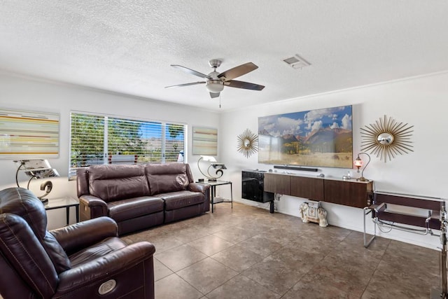 living room featuring crown molding, a textured ceiling, and ceiling fan