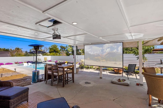 view of patio / terrace with a fenced in pool