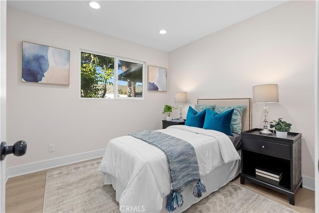 bedroom with light hardwood / wood-style floors