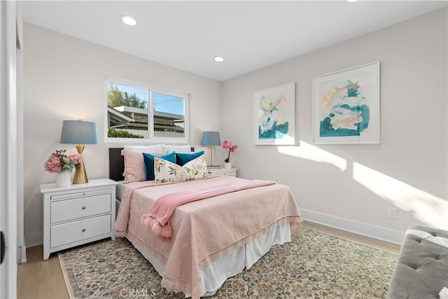 bedroom with light wood-type flooring