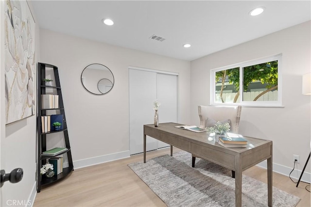 office space with light hardwood / wood-style flooring