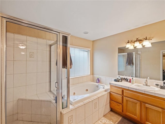 bathroom featuring separate shower and tub, vanity, and tile patterned flooring