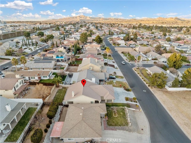 birds eye view of property featuring a mountain view