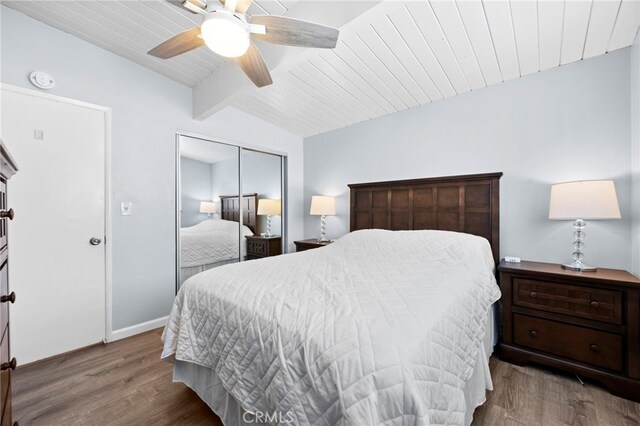 bedroom with ceiling fan, wooden ceiling, lofted ceiling with beams, a closet, and hardwood / wood-style flooring