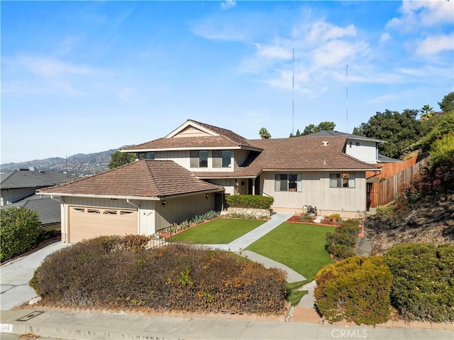 view of front facade with a front yard and a garage