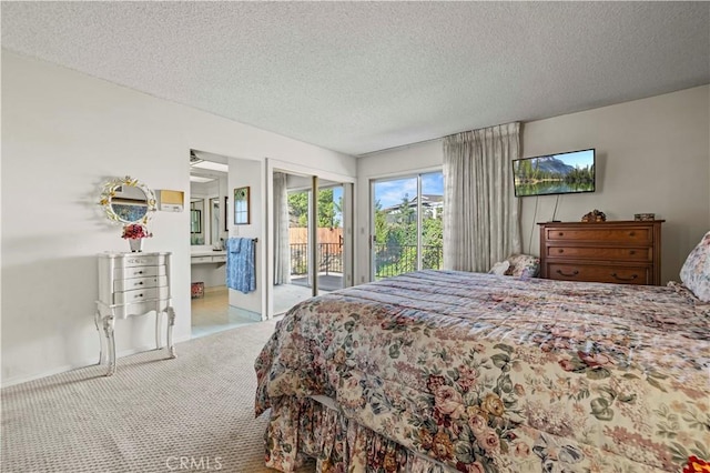 carpeted bedroom with a textured ceiling and access to exterior