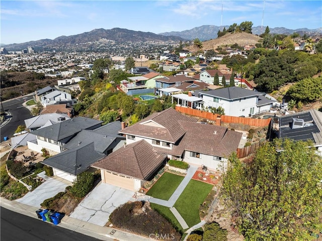 birds eye view of property with a mountain view