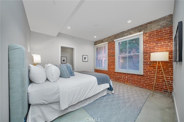 bedroom with brick wall