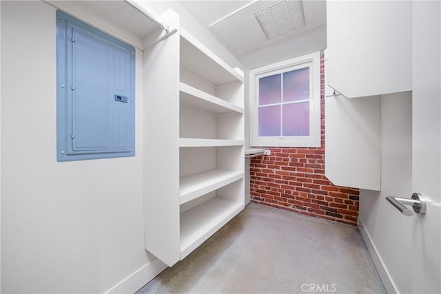 spacious closet featuring electric panel