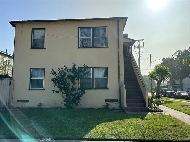 view of home's exterior featuring a yard