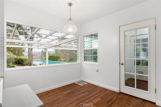 unfurnished sunroom featuring a healthy amount of sunlight