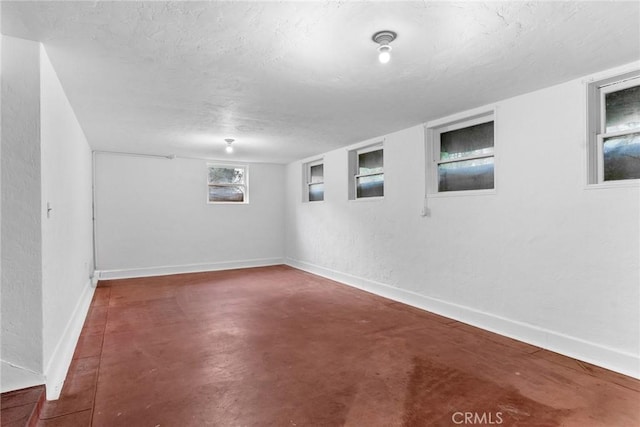 basement with a textured ceiling