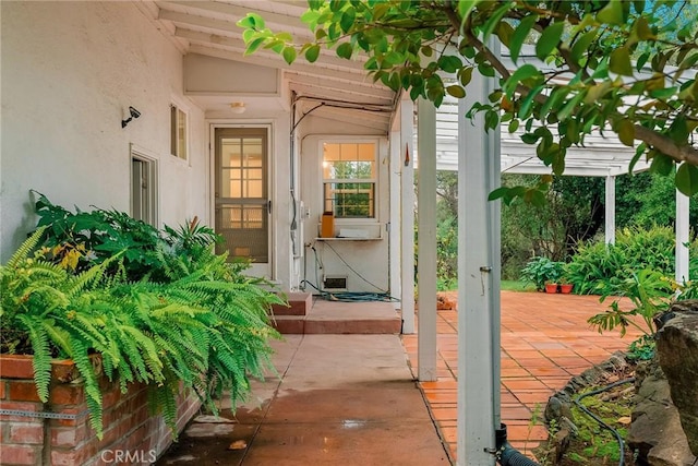 entrance to property with a patio area