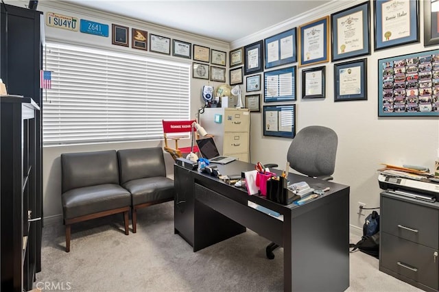 office area with light colored carpet, crown molding, and baseboards