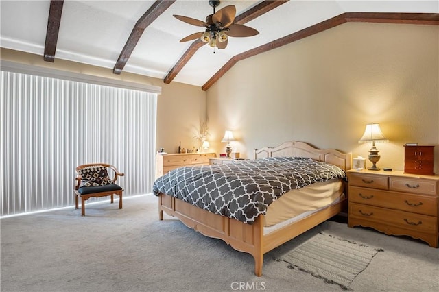 bedroom featuring light colored carpet, vaulted ceiling with beams, and a ceiling fan