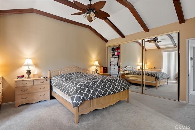 bedroom with light carpet, vaulted ceiling with beams, a closet, and a ceiling fan