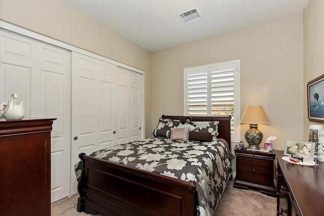 carpeted bedroom featuring a closet