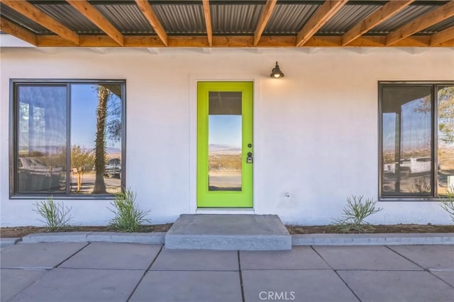 doorway to property featuring a patio