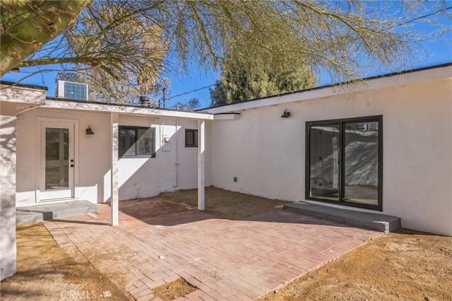 rear view of property featuring a patio area