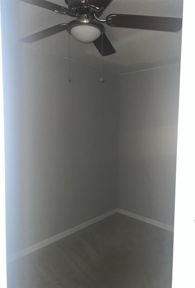 unfurnished room featuring ceiling fan