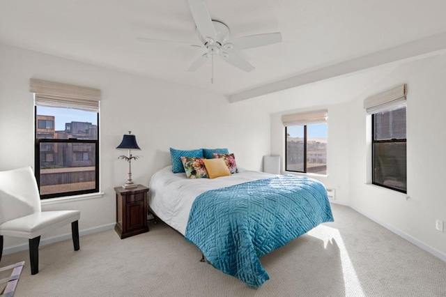 bedroom with light colored carpet and ceiling fan