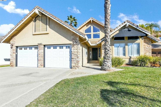 view of front of property with a front lawn and a garage