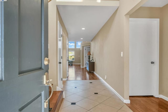 hallway with light tile patterned floors