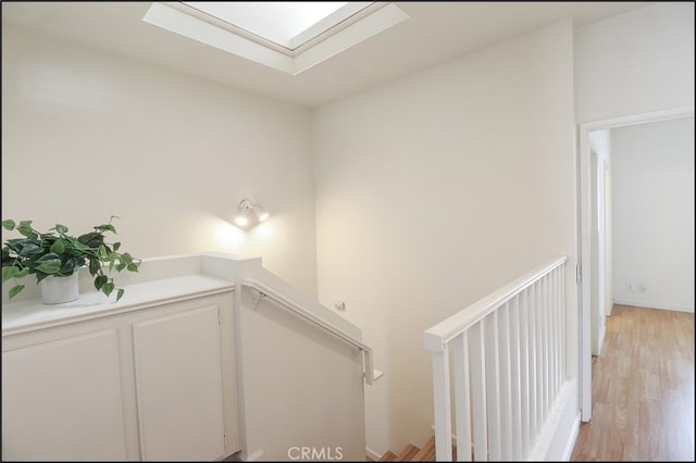 staircase featuring hardwood / wood-style floors