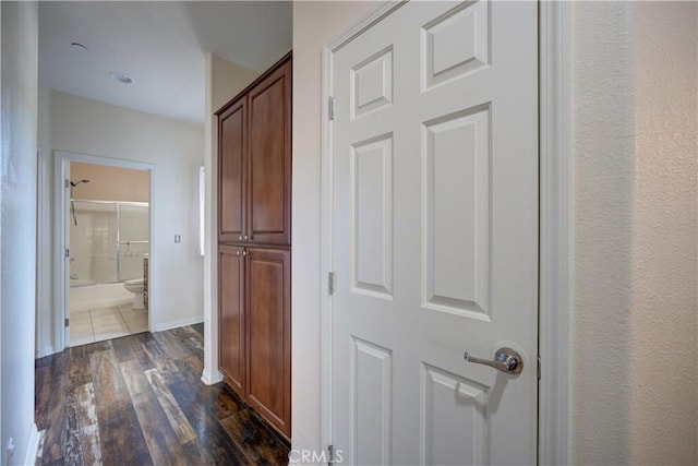 hall with dark hardwood / wood-style floors