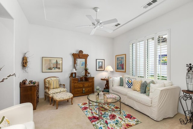 living room featuring ceiling fan and light colored carpet