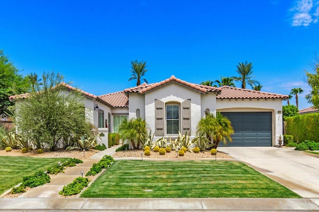 mediterranean / spanish-style house featuring a front lawn and a garage