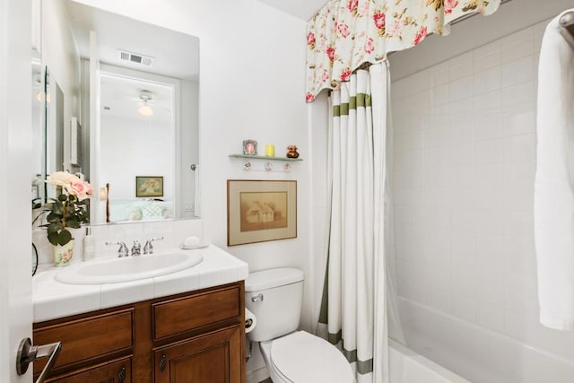 full bathroom with toilet, shower / tub combo, and vanity