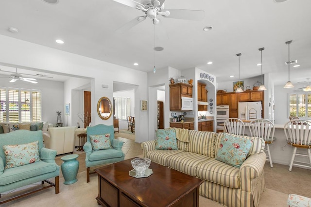 living room featuring ceiling fan and light tile patterned flooring