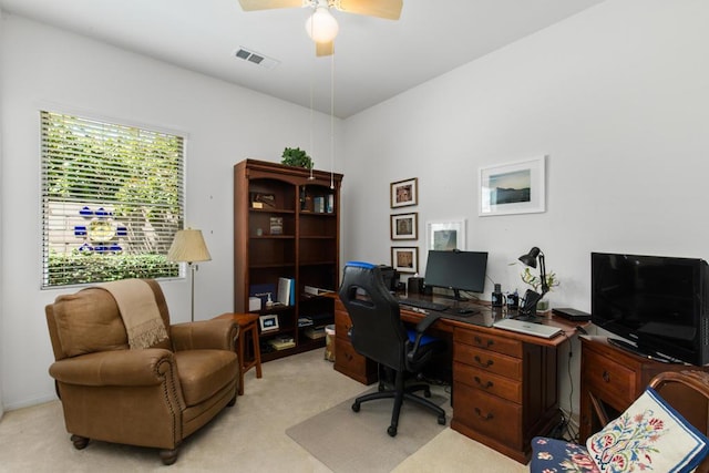 office space featuring ceiling fan and light colored carpet