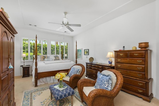 bedroom featuring ceiling fan and light carpet