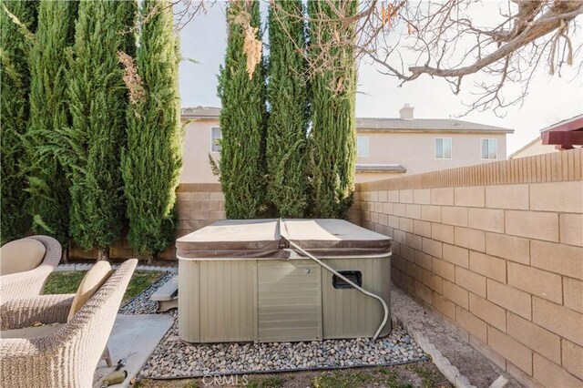 view of patio / terrace featuring a hot tub