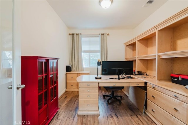 home office featuring hardwood / wood-style flooring