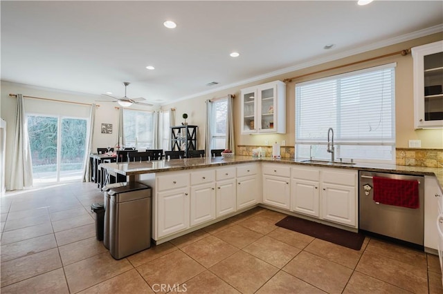 kitchen with sink, white cabinetry, and stainless steel dishwasher