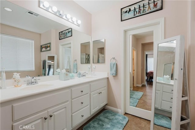 bathroom featuring vanity and tile patterned flooring