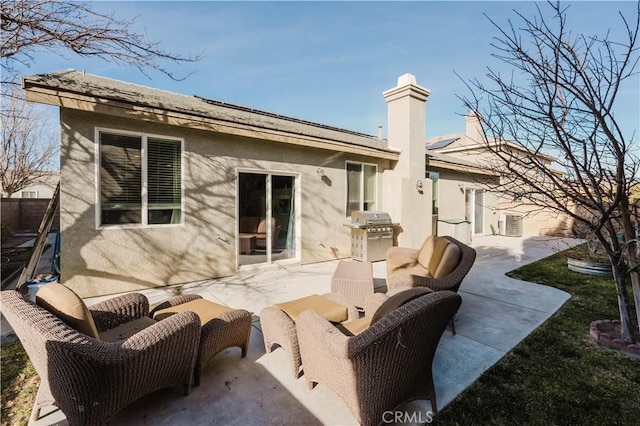44620 Painted Desert St, Lancaster, CA 93536 - back of house featuring stucco siding, a chimney, an outdoor living space, a patio area, and fence