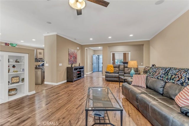 44620 Painted Desert St, Lancaster, CA 93536 - living area with built in features, baseboards, ornamental molding, ceiling fan, and light wood-style flooring