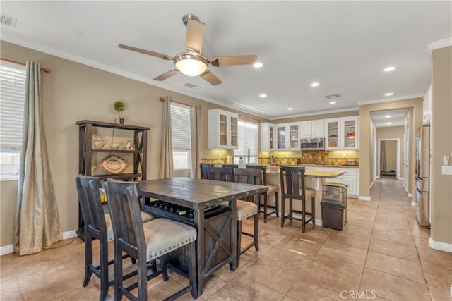 44620 Painted Desert St, Lancaster, CA 93536 - dining area with light tile patterned floors, a ceiling fan, ornamental molding, recessed lighting, and baseboards