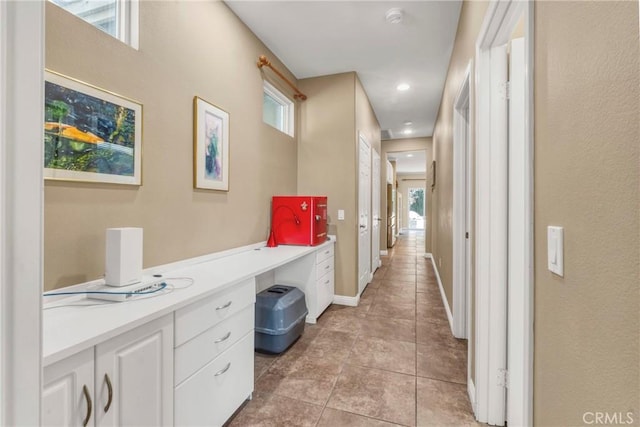 44620 Painted Desert St, Lancaster, CA 93536 - corridor featuring light tile patterned floors and baseboards