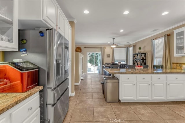 44620 Painted Desert St, Lancaster, CA 93536 - kitchen featuring crown molding, visible vents, white cabinetry, and light tile patterned floors
