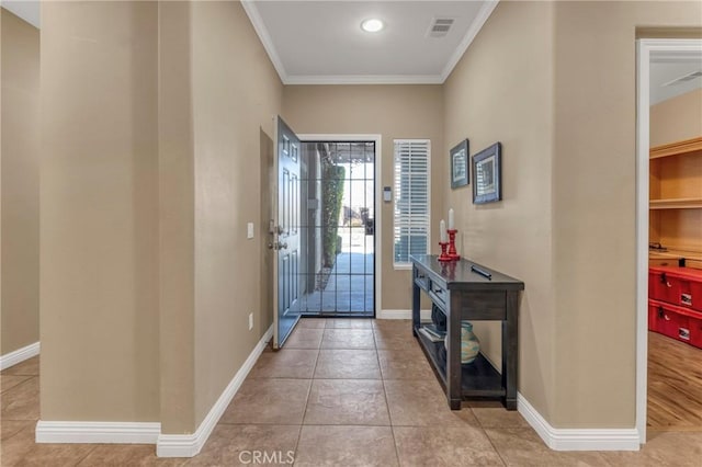 44620 Painted Desert St, Lancaster, CA 93536 - tiled entryway with baseboards, ornamental molding, and visible vents