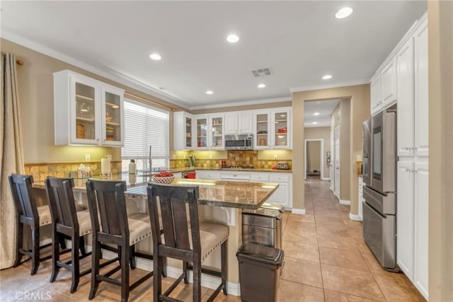 44620 Painted Desert St, Lancaster, CA 93536 - kitchen featuring a peninsula, appliances with stainless steel finishes, and white cabinetry